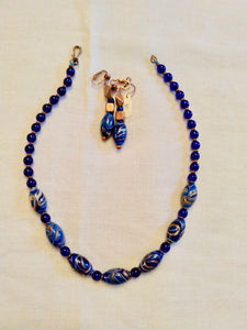 19" necklace. 8mm cobalt glass beads, 7 rare Venetian Feather glass & copper beads, Copper accents & clasp. $75  Earrings $30
